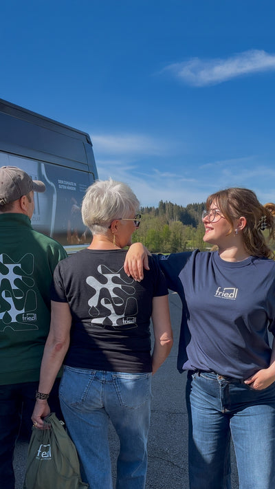 Company wearing personalized ShirtUp! clothing outdoors